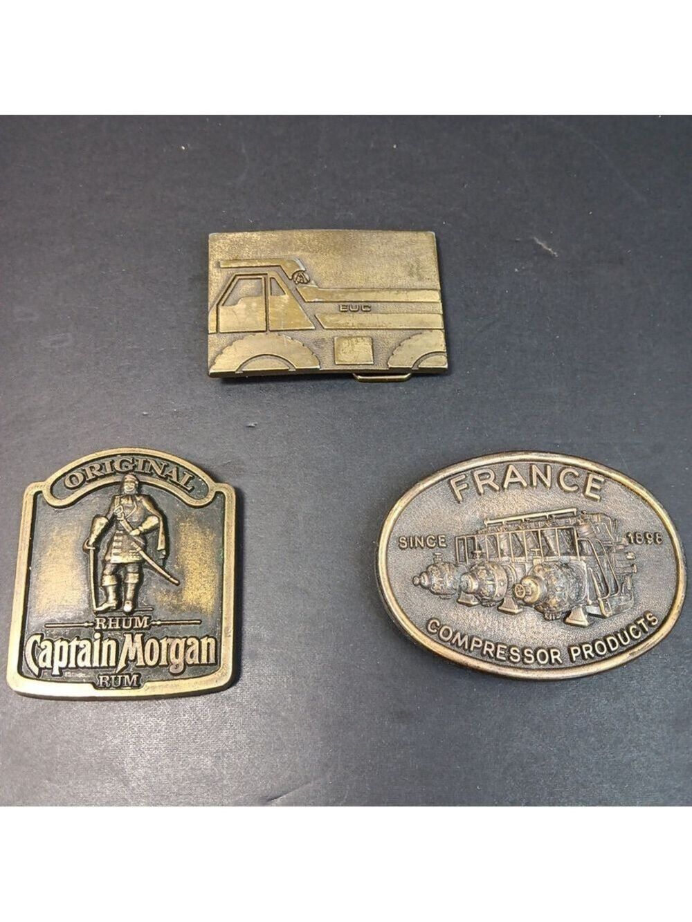 Lot Of 3 Vintage Belt Buckles, EUC France Compressor Products Captain Morgan